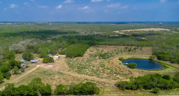 a view of a lake with a yard