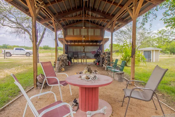 a view of a patio with a table chairs and a table
