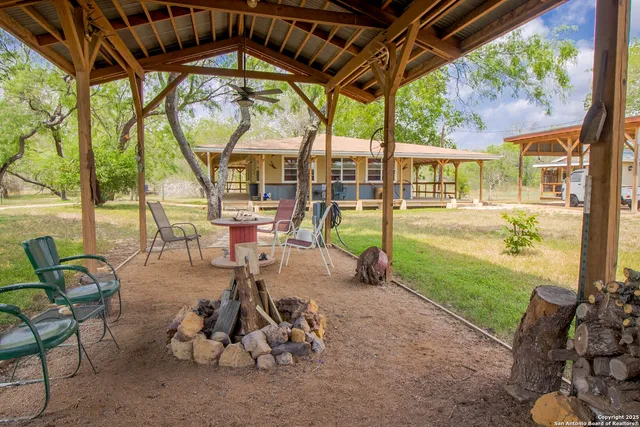 a view of yard with patio