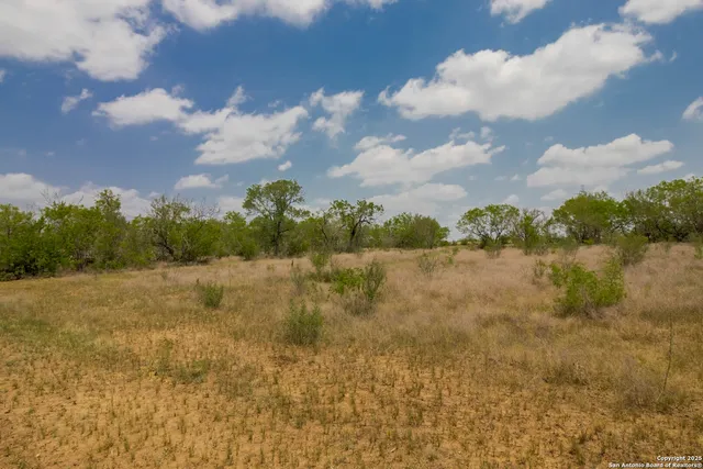 a view of lake with green space