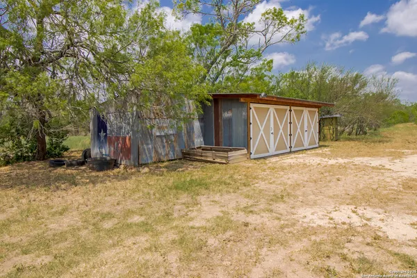 a view of a backyard of the house