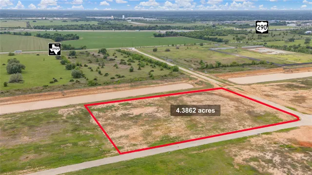 a view of a field with an ocean view