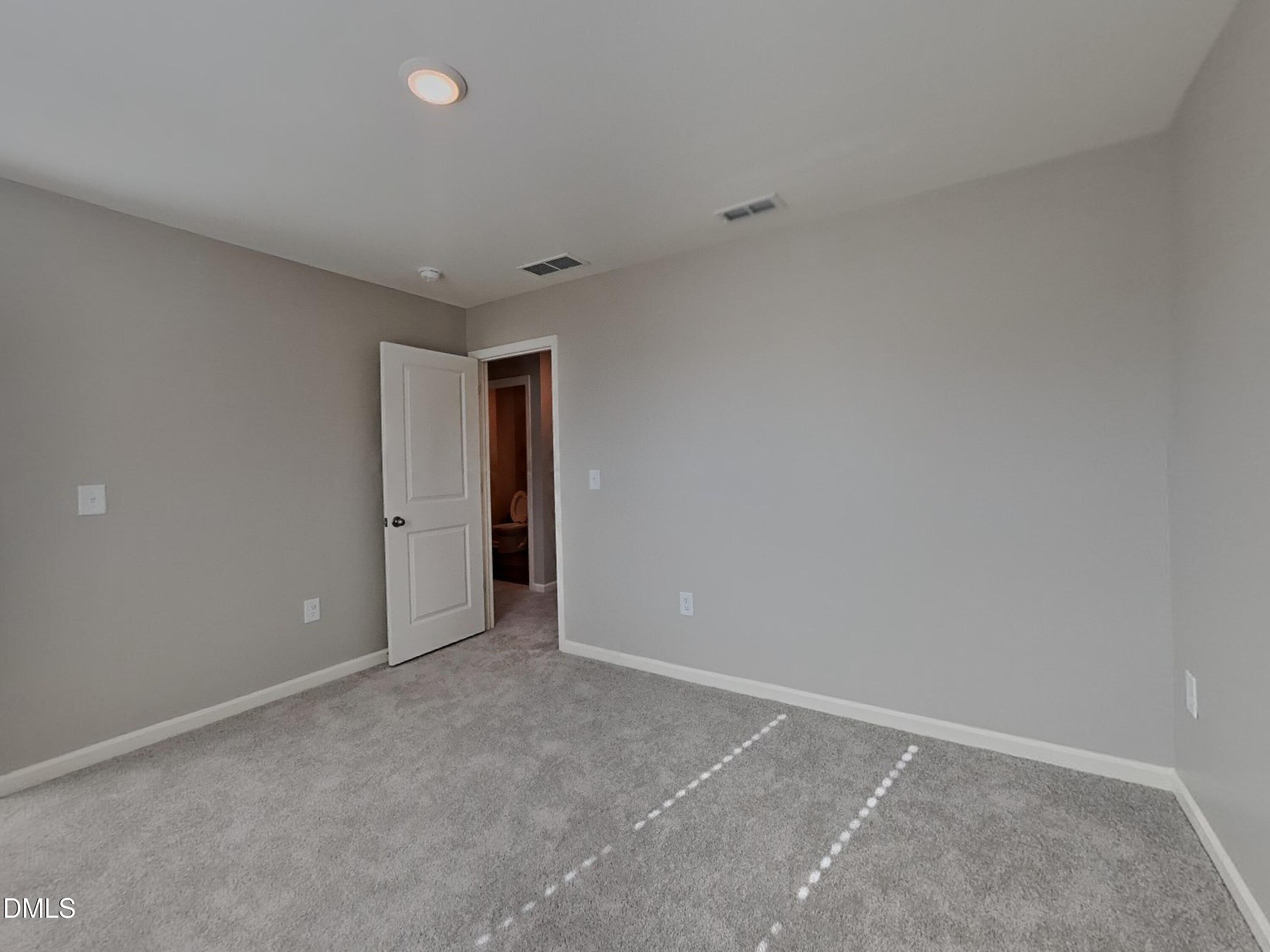 152 Glad Stone Loop Clayton, NC 27520 - Photo 11 of 20 a view of an empty room