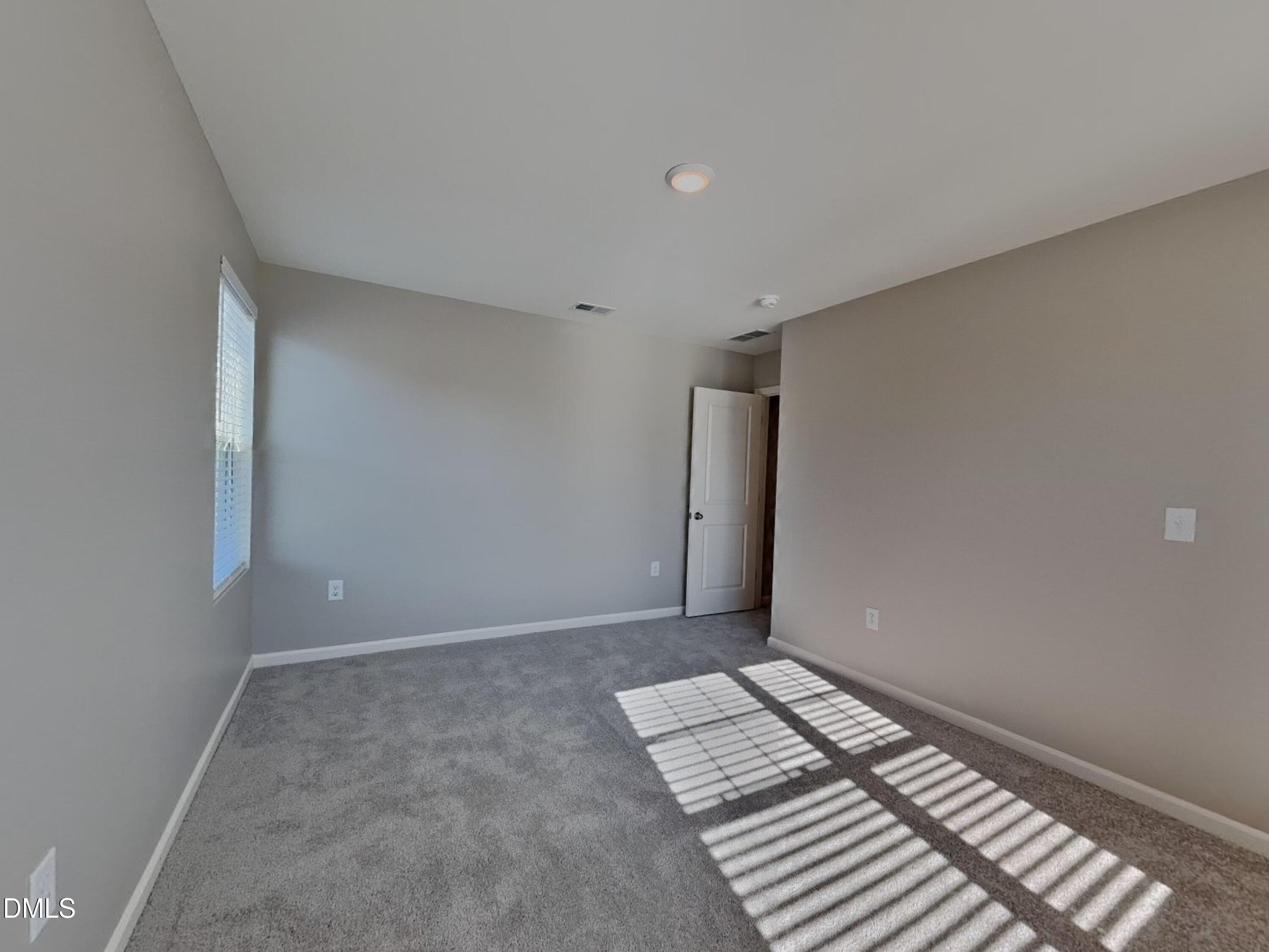 152 Glad Stone Loop Clayton, NC 27520 - Photo 13 of 20 a view of room with window