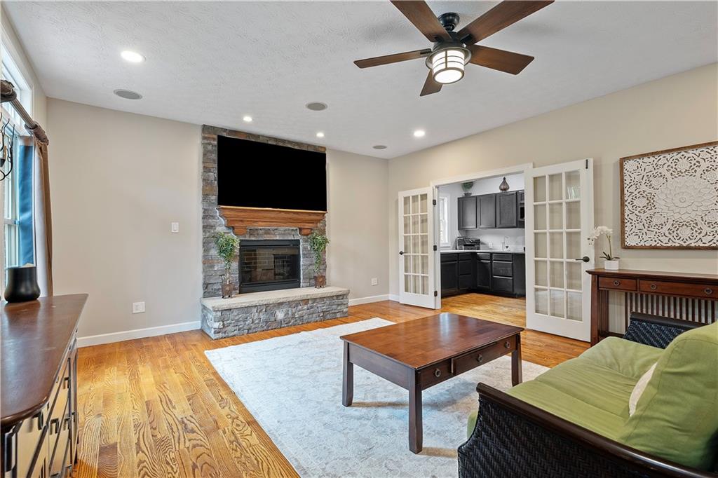 192 Baldwin Road Carnegie, PA 15106 - Photo 11 of 50 a living room with furniture flat screen tv and a fireplace