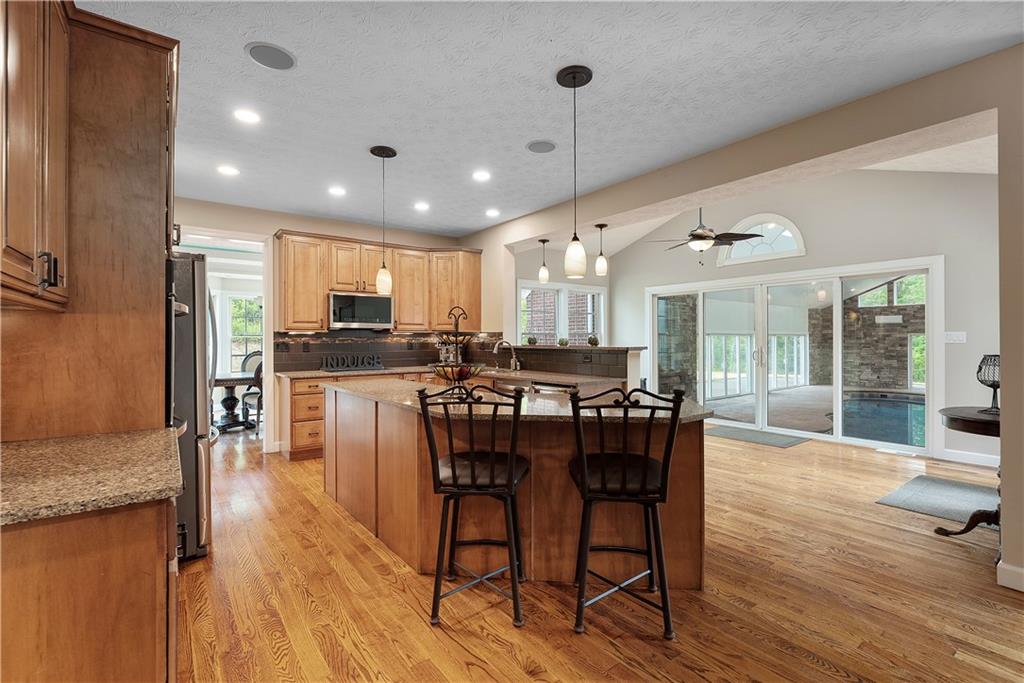 192 Baldwin Road Carnegie, PA 15106 - Photo 14 of 50 a view of a dining room and livingroom with furniture wooden floor a chandelier