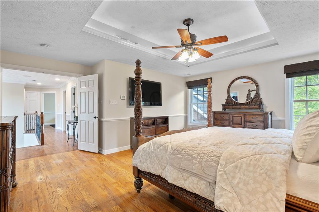 192 Baldwin Road Carnegie, PA 15106 - Photo 27 of 50 a bedroom with a bed a dresser and flat screen tv