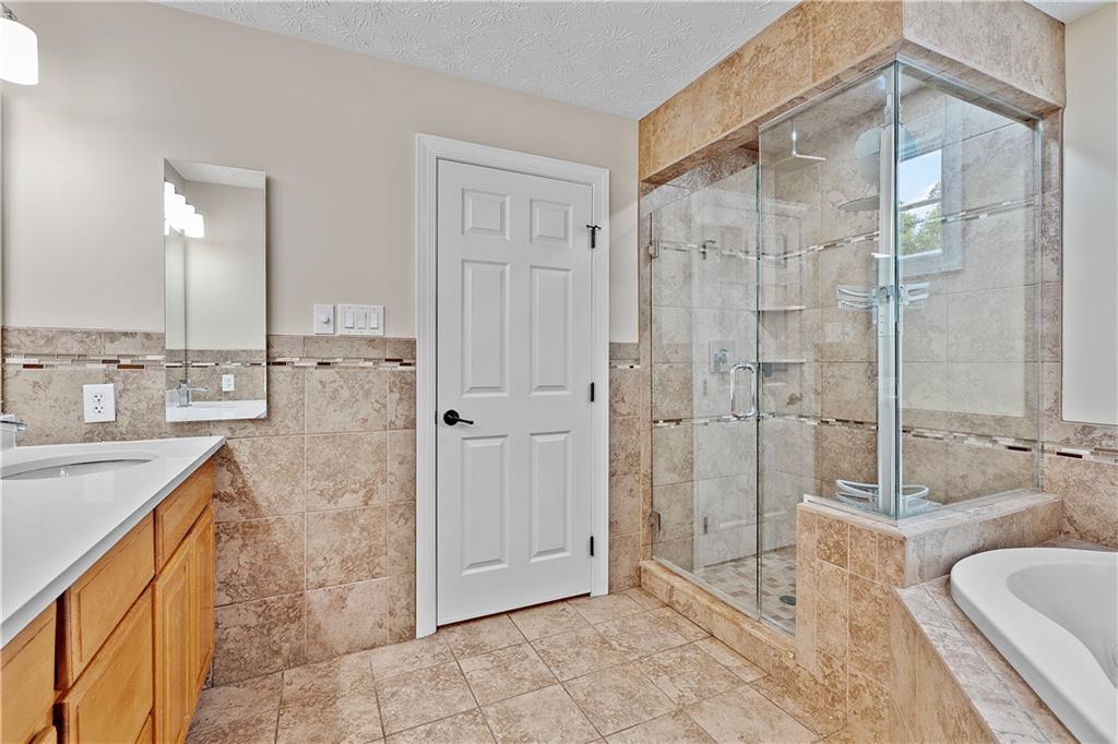 192 Baldwin Road Carnegie, PA 15106 - Photo 31 of 50 a spacious bathroom with a granite countertop sink a toilet and shower