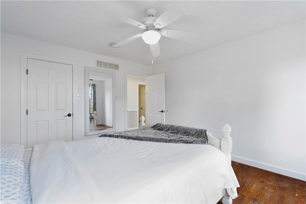 192 Baldwin Road Carnegie, PA 15106 - Photo 35 of 50 a bedroom with a bed and a chandelier