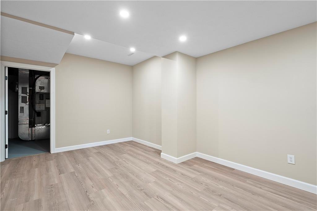 192 Baldwin Road Carnegie, PA 15106 - Photo 39 of 50 a view of an empty room with wooden floor