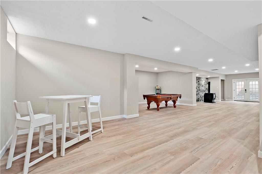 192 Baldwin Road Carnegie, PA 15106 - Photo 41 of 50 a large room with wooden floor and chairs