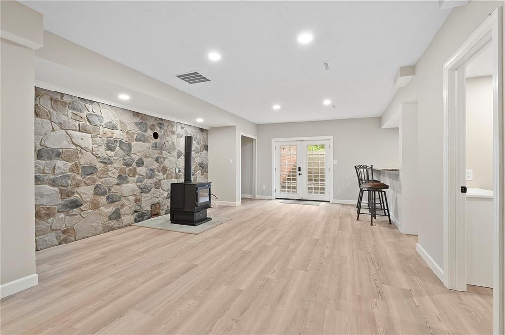 192 Baldwin Road Carnegie, PA 15106 - Photo 42 of 50 a view of empty room with wooden floor and fireplace