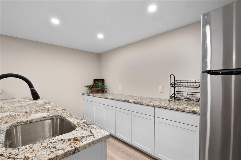 192 Baldwin Road Carnegie, PA 15106 - Photo 46 of 50 a kitchen with granite countertop white cabinets and white appliances