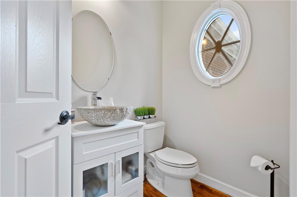192 Baldwin Road Carnegie, PA 15106 - Photo 6 of 50 a bathroom with a toilet a sink and mirror