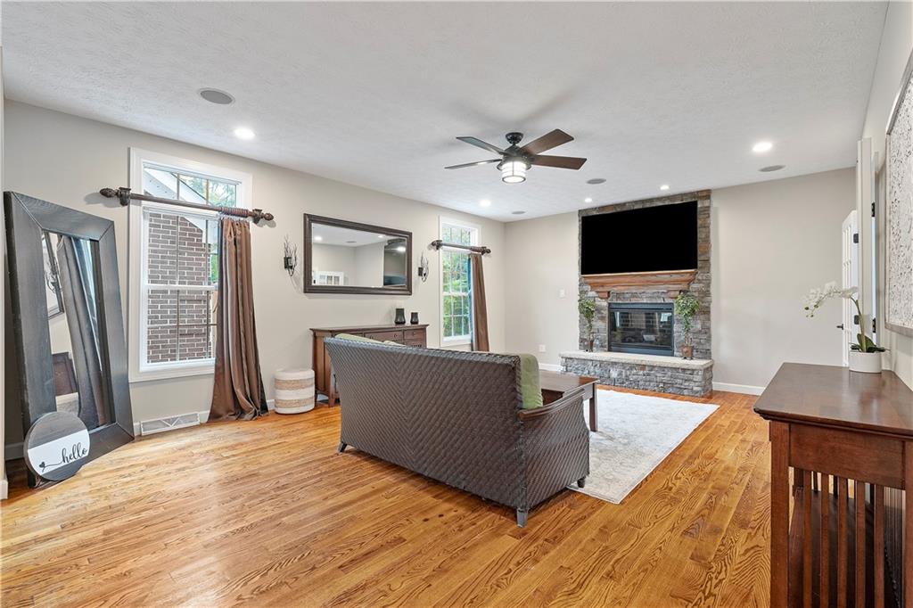 192 Baldwin Road Carnegie, PA 15106 - Photo 8 of 50 a living room with furniture a fireplace and a flat screen tv