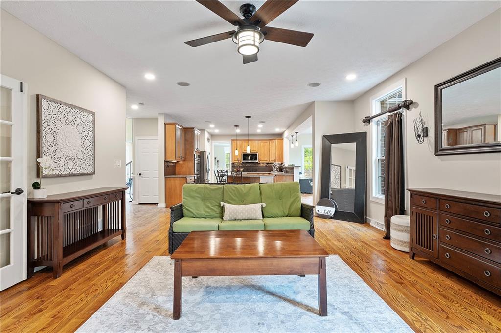 192 Baldwin Road Carnegie, PA 15106 - Photo 10 of 50 a living room with furniture a fireplace and a ceiling fan