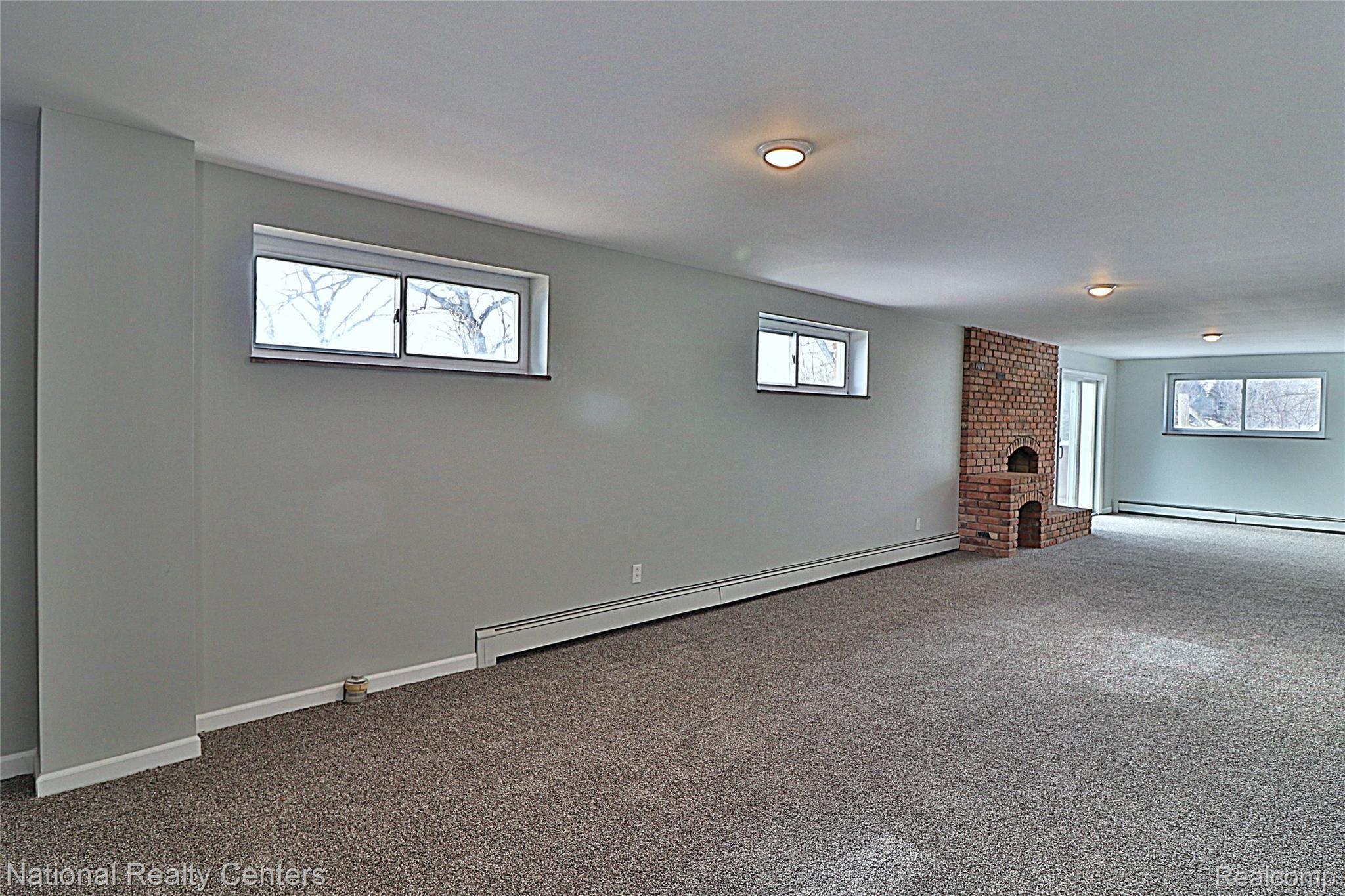 8290 Bergin Road Howell, MI 48843 - Photo 28 of 47 Rec Room Area in Basement