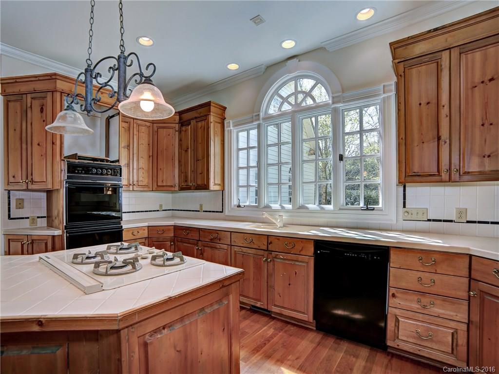 2101 Scotland Ridge Road Charlotte, NC 28211 - Photo 11 of 24 a kitchen with a sink stove and cabinets