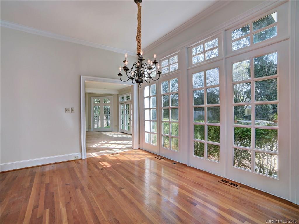 2101 Scotland Ridge Road Charlotte, NC 28211 - Photo 13 of 24 a view of an empty room with wooden floor and a window
