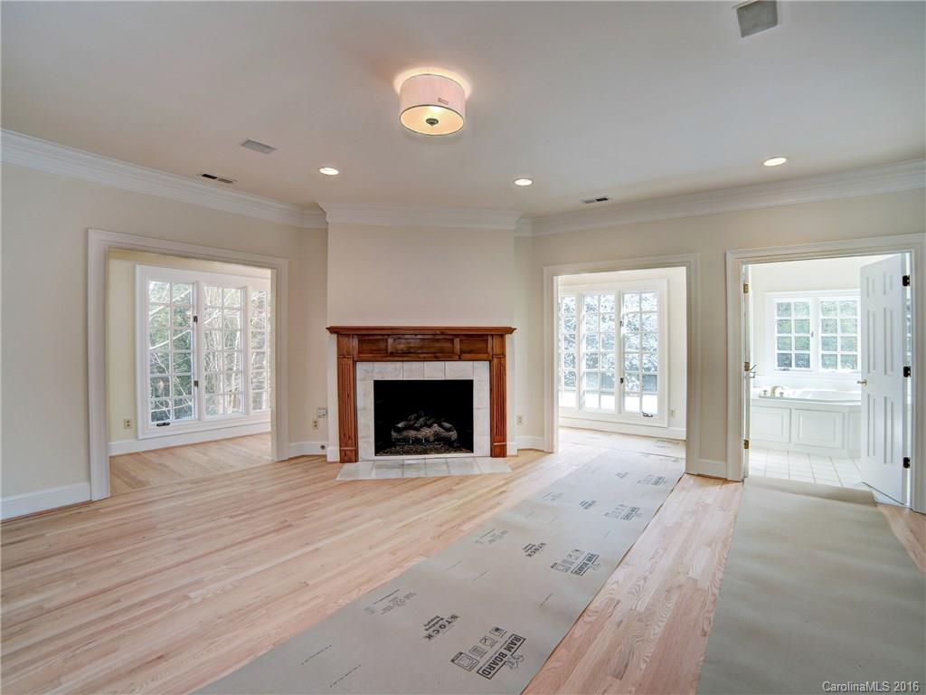 2101 Scotland Ridge Road Charlotte, NC 28211 - Photo 14 of 24 a view of an empty room with a window and a fireplace