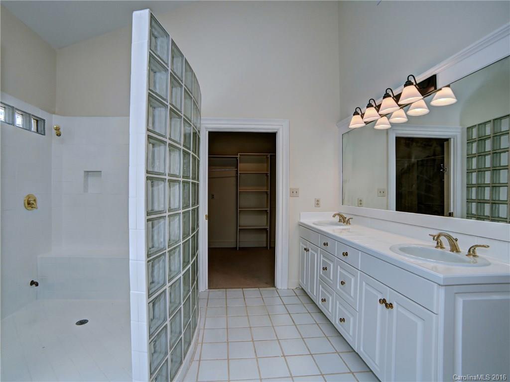 2101 Scotland Ridge Road Charlotte, NC 28211 - Photo 15 of 24 a bathroom with a double vanity sink and a mirror