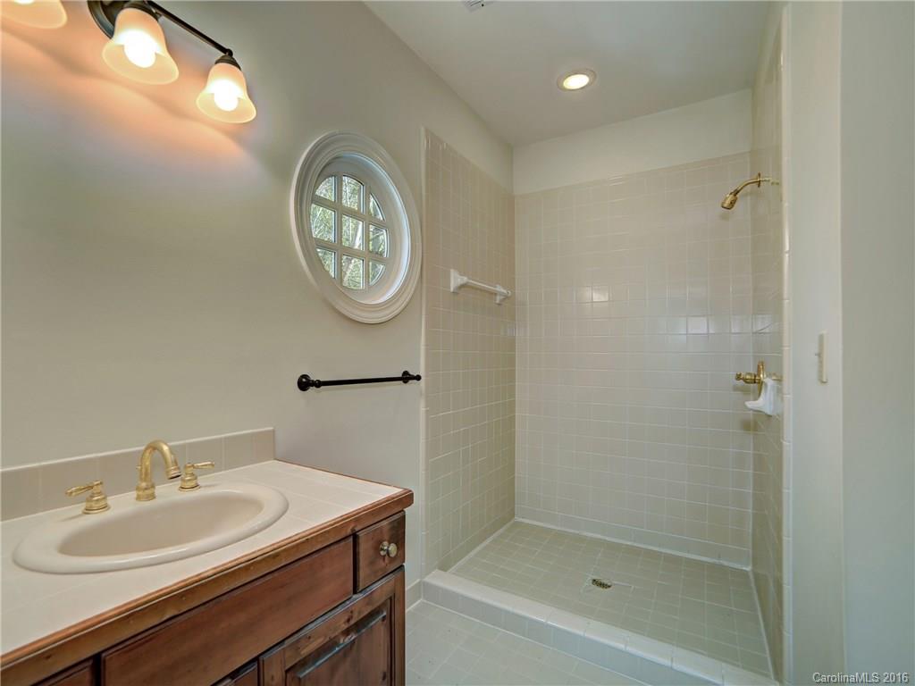 2101 Scotland Ridge Road Charlotte, NC 28211 - Photo 17 of 24 a bathroom with a sink and a mirror