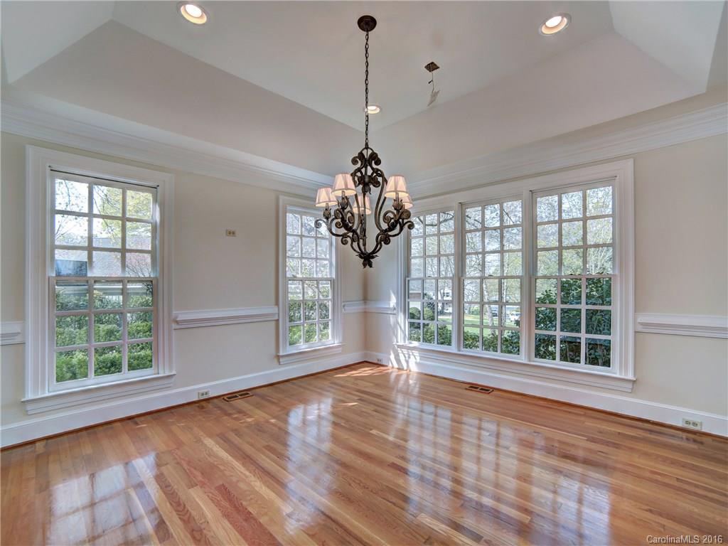 2101 Scotland Ridge Road Charlotte, NC 28211 - Photo 5 of 24 a view of an empty room with wooden floor and a window