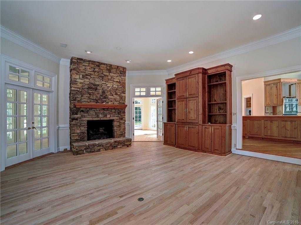 2101 Scotland Ridge Road Charlotte, NC 28211 - Photo 7 of 24 a view of a kitchen with a refrigerator a ceiling fan and wooden floor