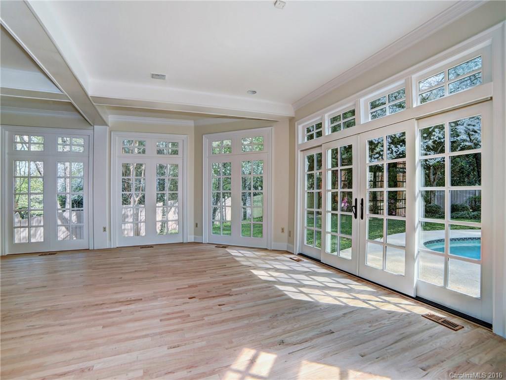 2101 Scotland Ridge Road Charlotte, NC 28211 - Photo 9 of 24 a view of an empty room with wooden floor and a window