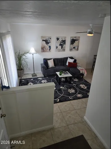 a living room with furniture and a rug