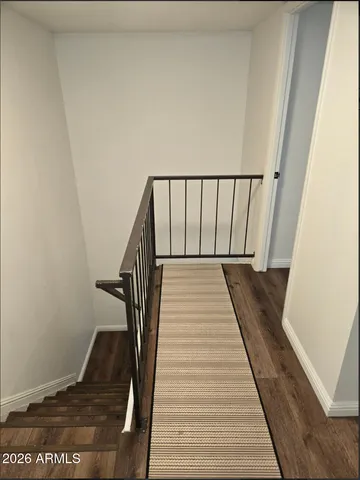a view of a hallway with a refrigerator