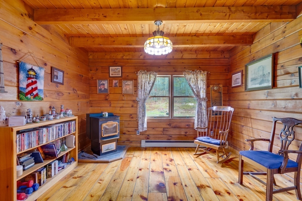 207 West Princeton Road Westminster, MA 01473 - Photo 13 of 36 a living room with furniture a bookshelf and a window