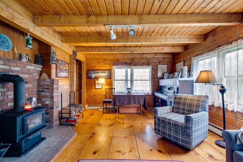 207 West Princeton Road Westminster, MA 01473 - Photo 7 of 36 a living room with furniture and a fireplace