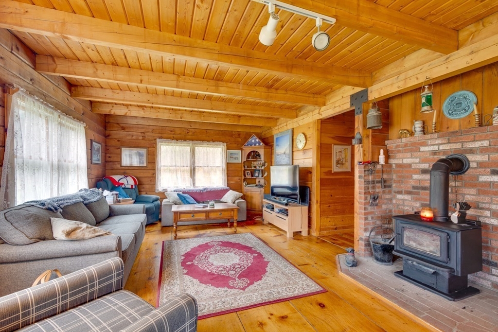 207 West Princeton Road Westminster, MA 01473 - Photo 10 of 36 a living room with furniture a dining table and chairs with wooden floor