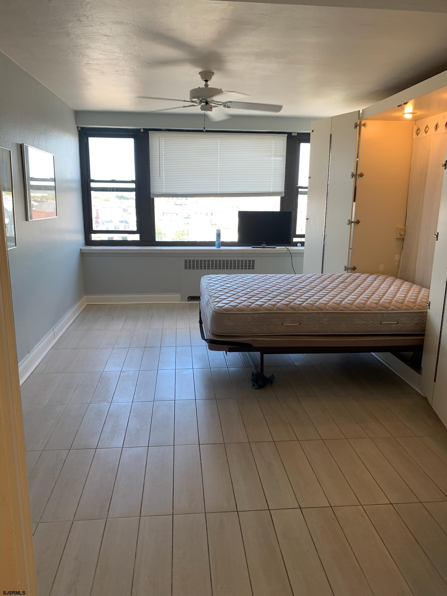 101 South Raleigh Avenue, Unit 613 Atlantic City, NJ 08401 - Photo 2 of 8 a bedroom with a bed and window