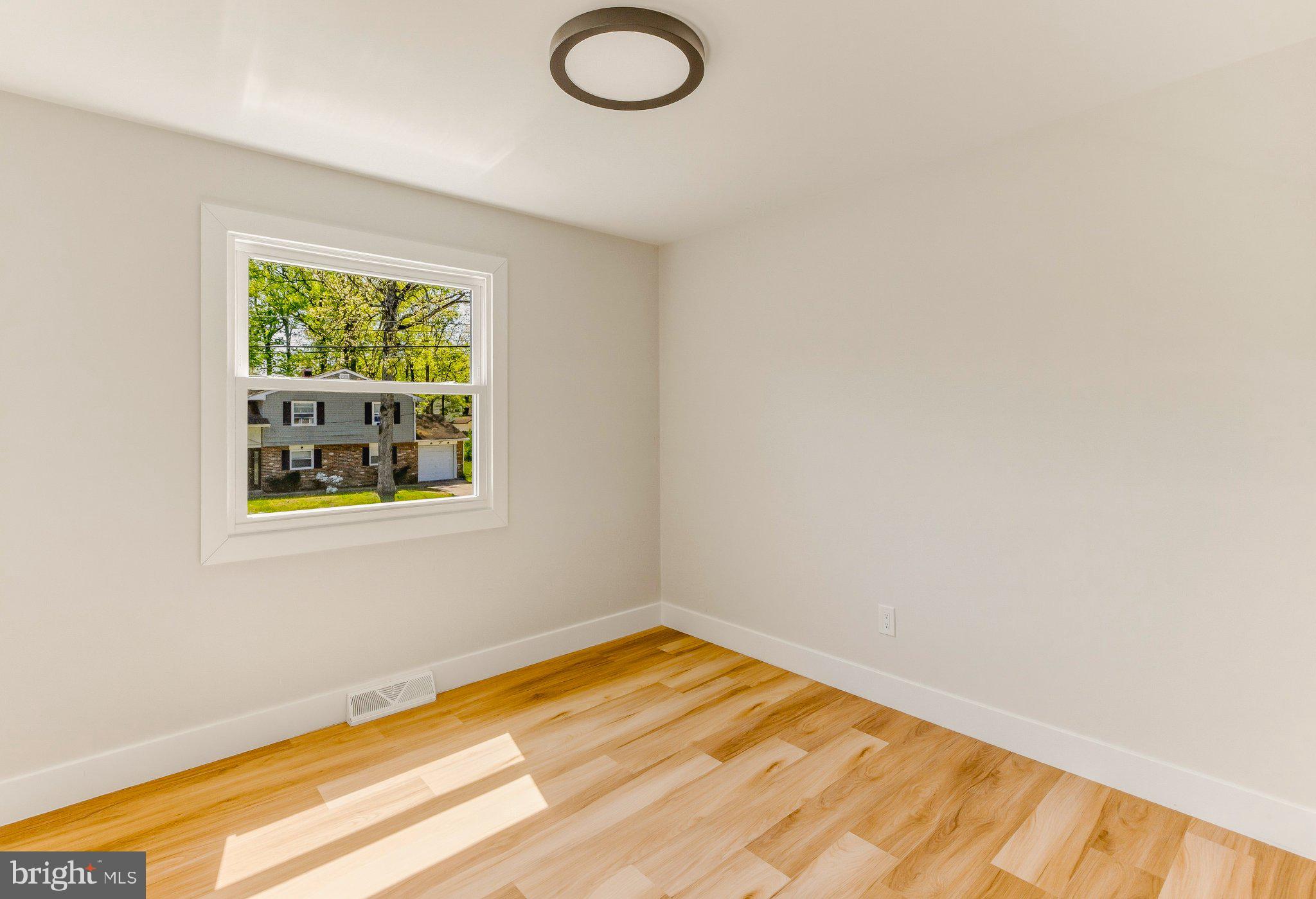 11 Yale Road Atco, NJ 08004 - Photo 18 of 20 a view of empty room with window and wooden floor