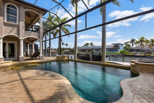 a couple of palm trees in front of house