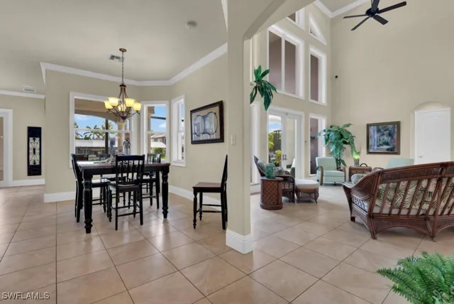 a living room with furniture a ceiling fan and a rug
