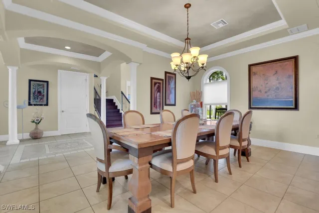 a living room with furniture and a ceiling fan