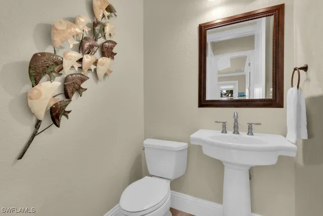 a view of staircase and hall with wooden floor and staircase