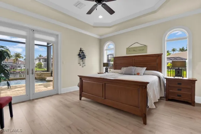 a view of a hallway with wooden floor and windows