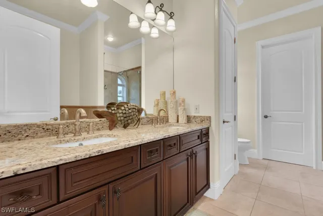 a bed room with a bed and a chair