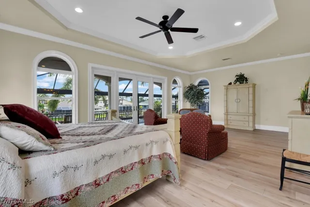 a bathroom with a granite countertop sink a large mirror and a window