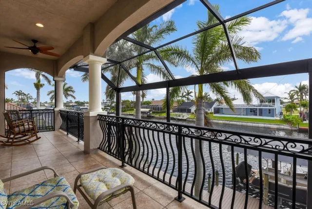 a building outdoor space with patio furniture and garden view