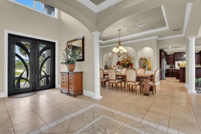 a kitchen with stainless steel appliances kitchen island granite countertop a stove top oven a sink dishwasher and cabinets