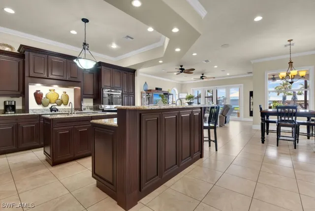 a kitchen with a stove sink and cabinets