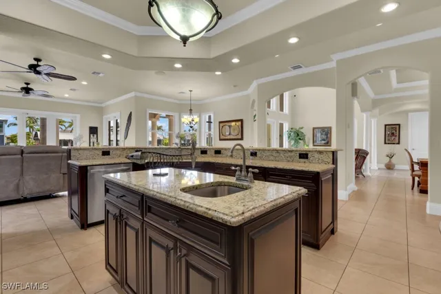 a kitchen with a sink and a refrigerator