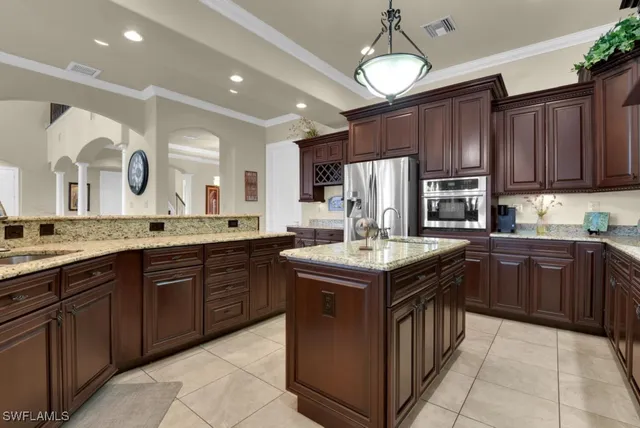 a view of a dining room with furniture and chandelier