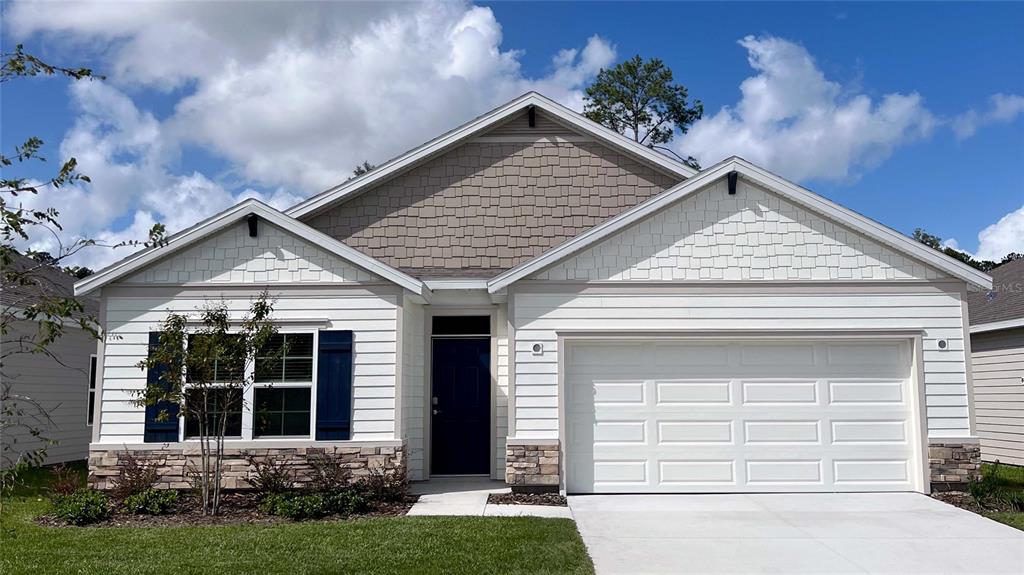 5184 Southwest 53rd Road Gainesville, FL 32608 - Photo 1 of 1 front view of a house with a yard