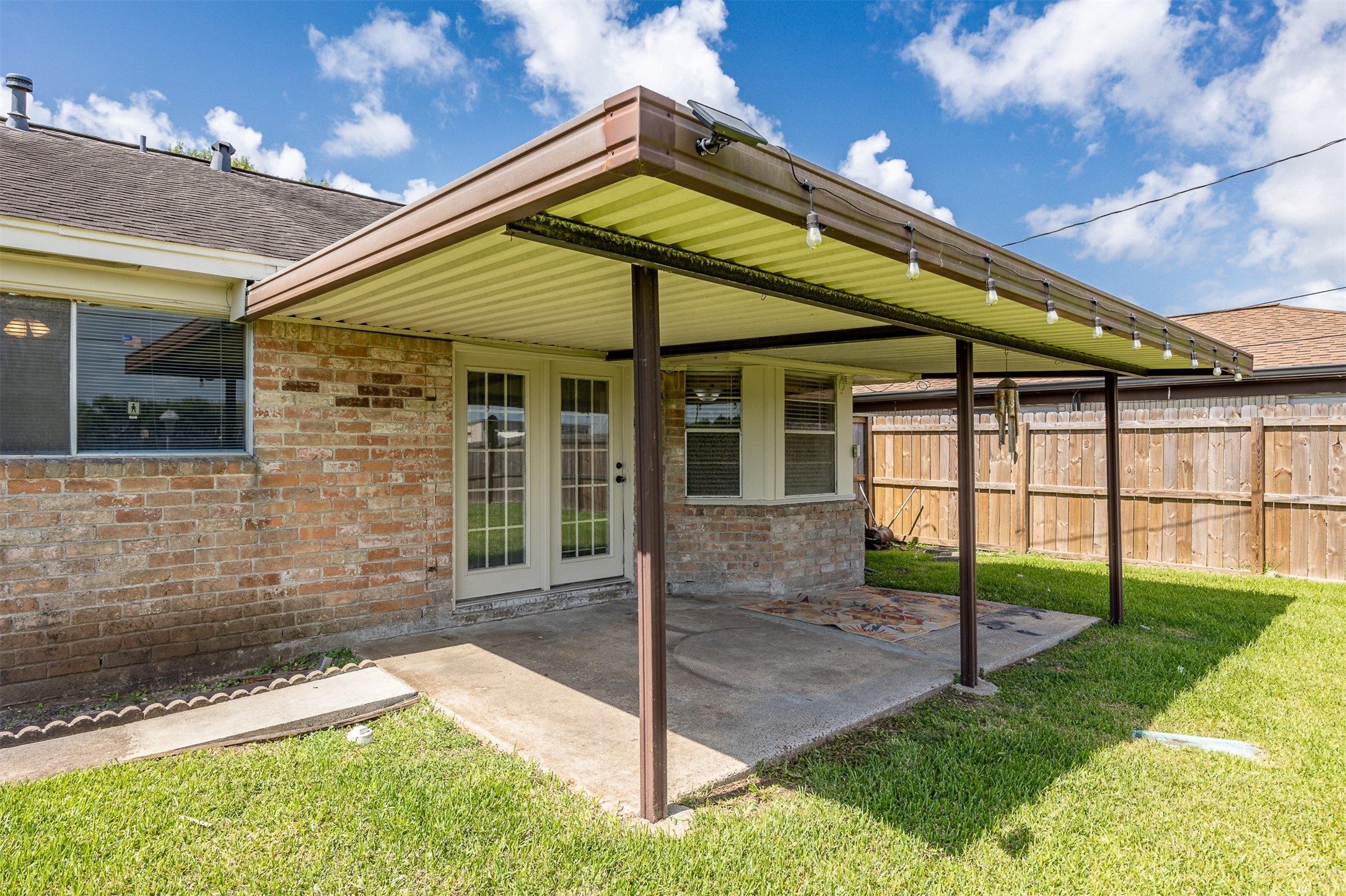 206 Kelly Lane Baytown, TX 77521 - Photo 33 of 38 This hot summer, you will appreciate the covered patio.